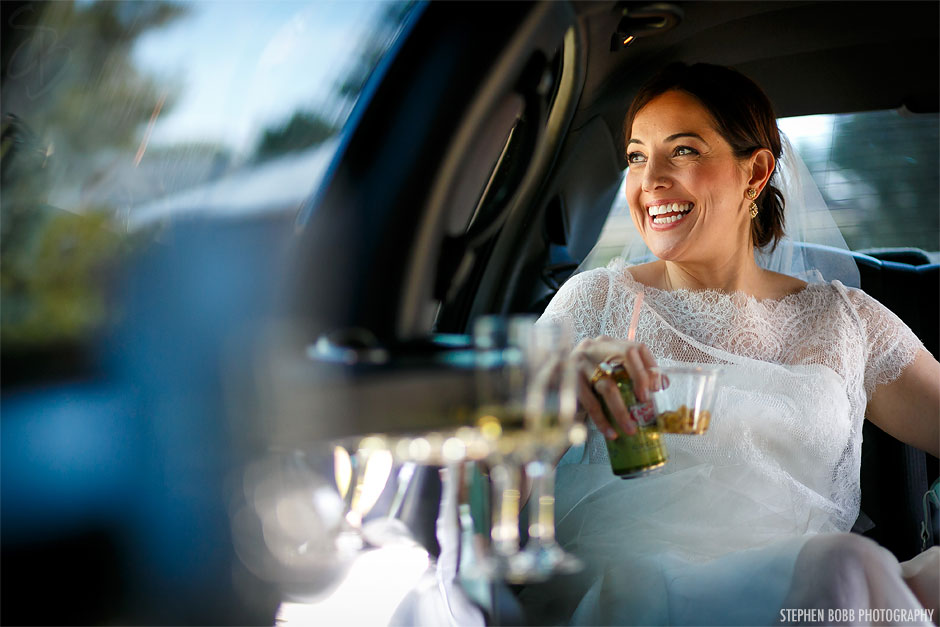 Bride laughing in limo | Ritz Carlton Tysons Corner Wedding Photos