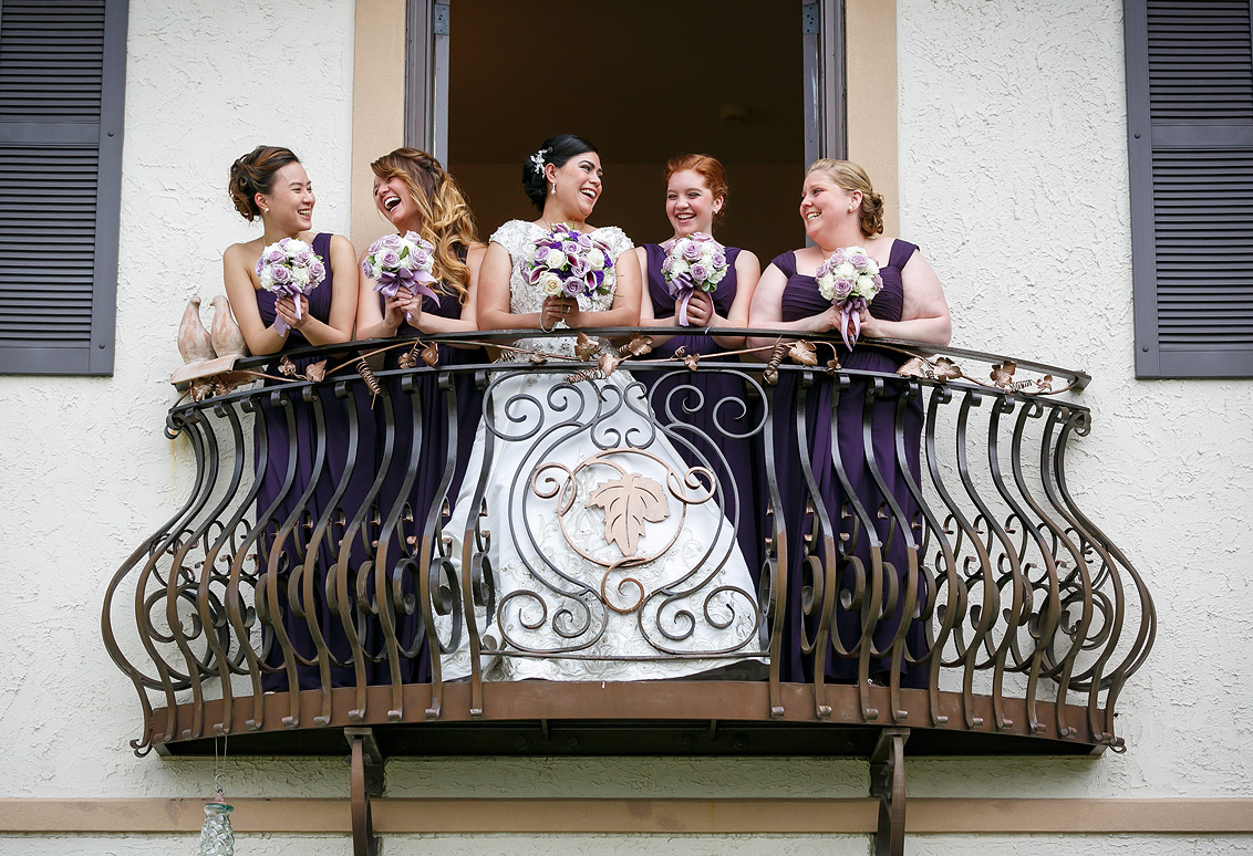 Potomac Point Winery Wedding photos - brides and bridesmaids on the balcony