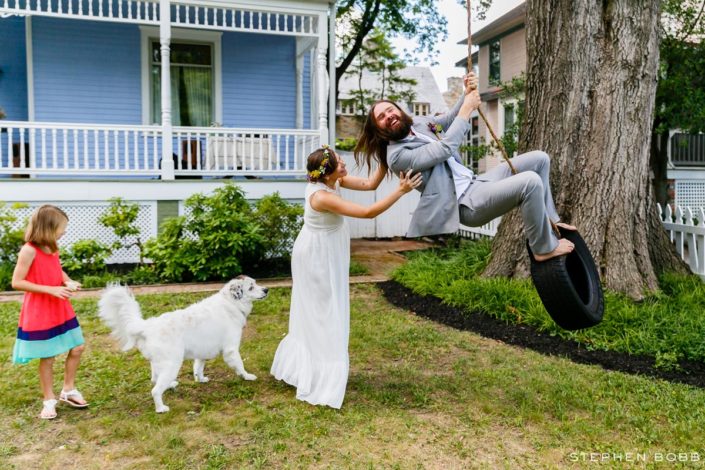 Couple on tire-swing at home wedding