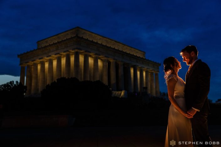 Bold backlit photo of wedding couple at Lincoln Memorial
